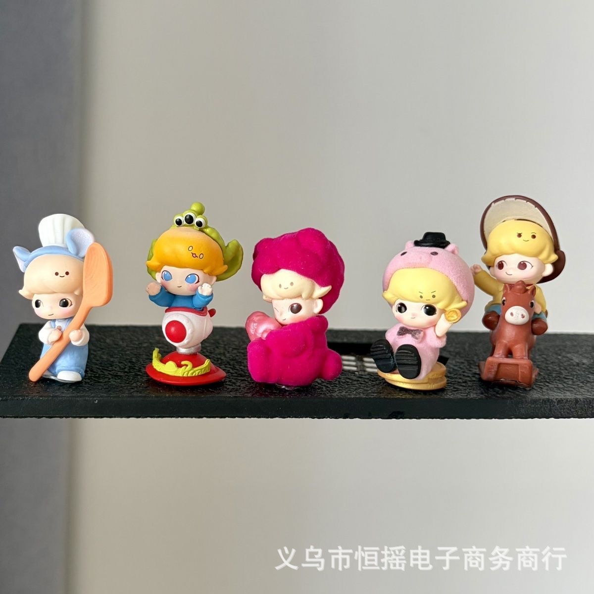 Popular decorative item: Cute Dimoo doll, a Pixar-themed dashboard accessory and phone charm for cars