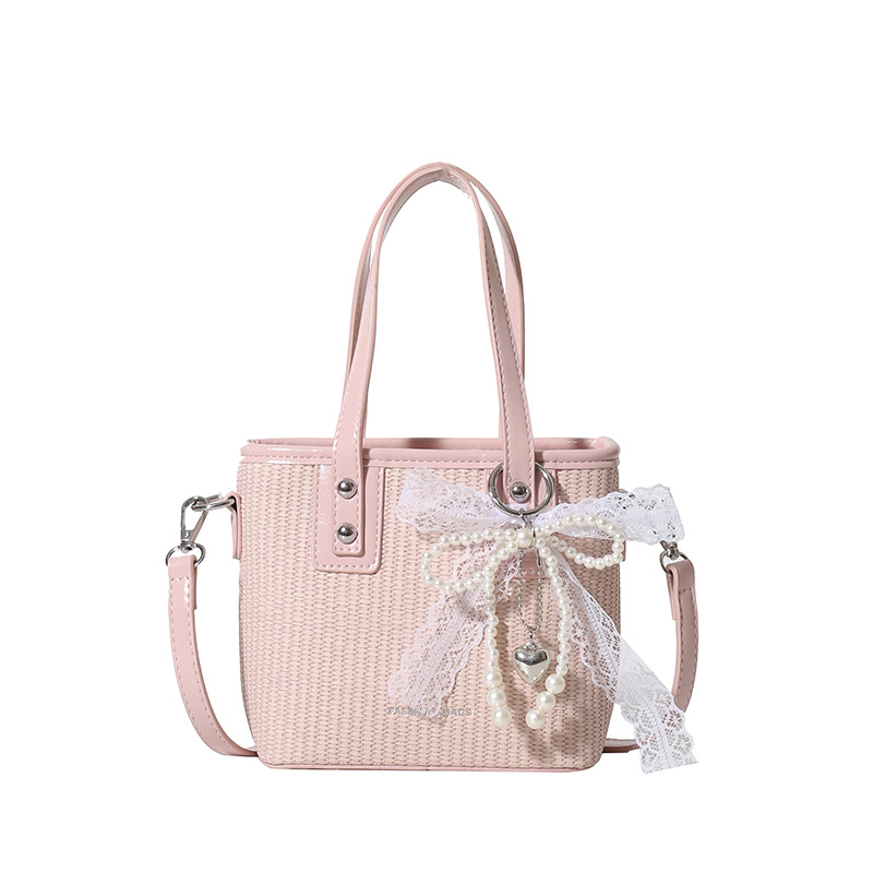 Bolsa de balde de mano caliente de verano para mujeres 2025 nueva bolsa de playa de vacaciones de playa bolsa de tejido bolsa de paja