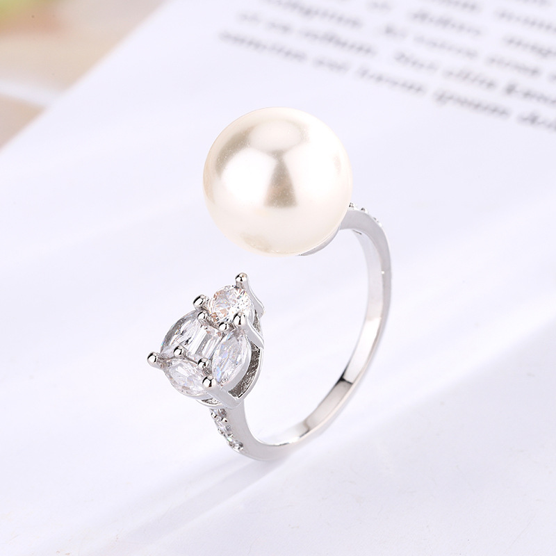 2024 nueva joyería cobre chapado en platino perla estilo simple anillo diario mujer 12mm al por mayor