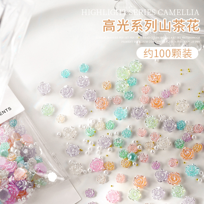 Uñas belleza hielo transparente resaltar Camelia decoraciones de uñas diamante suave tridimensional resina Internet celebridad Rosa bola de acero mezclado