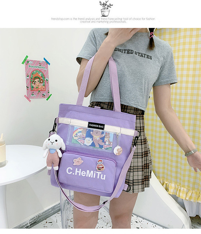 Korean-style canvas bag for girls with one shoulder, in the style of Harajuku, ulzzang, with a large capacity and contrasting colors, is a crossbody hand-held schoolbag for classes undefined