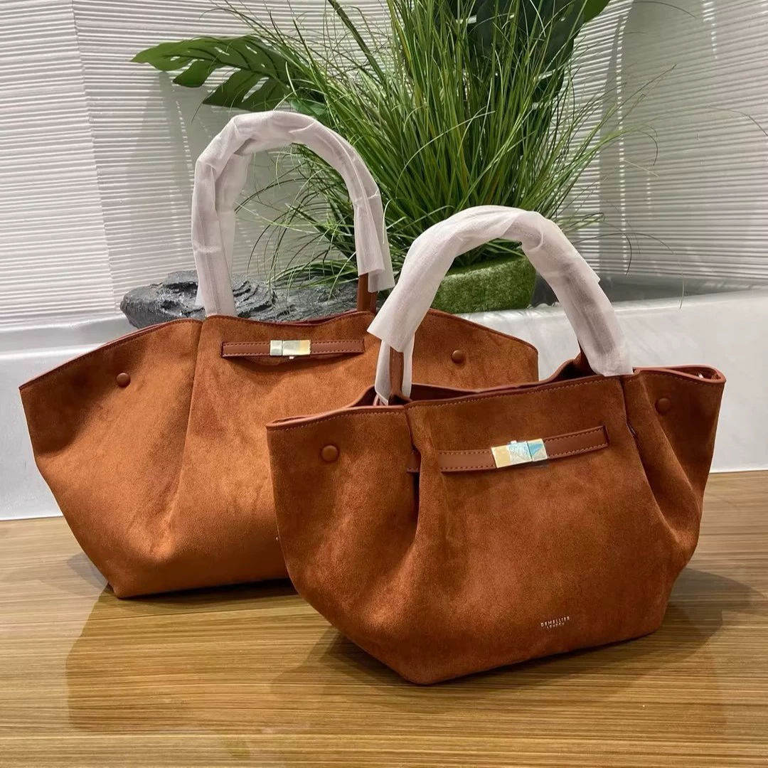 Handheld capacious purse, shoulder bag