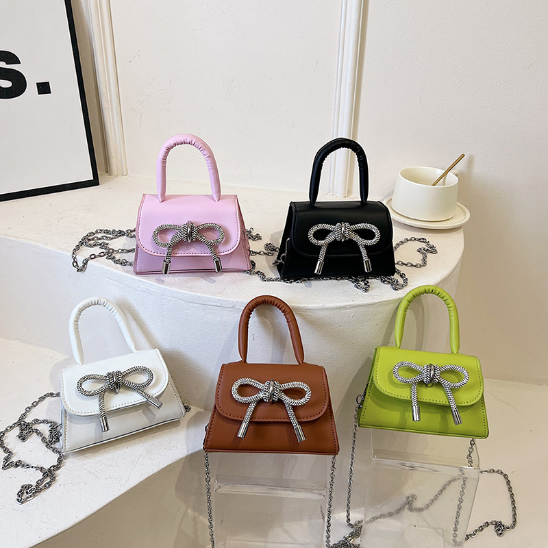 Moda al por mayor arco mini bolso mujer 2025 nuevo mochila bolso de hombro universal bolso de moda mujer