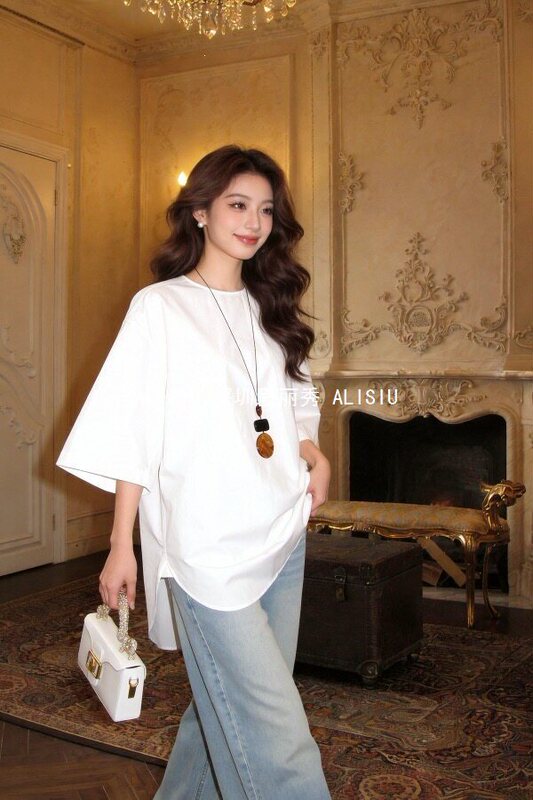 Designed with Buttons at the Back, Wide Sleeves, Long Style, Simple Round Neck, and Slit at the Hem Designed with Buttons at the Back, Wide Sleeves, Long Style, Simple Round Neck, and Slit at the Hem