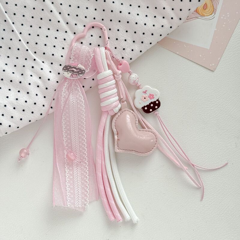 Korean-style pink cake heart bag charm with lace ribbon and woven string keychain, cute girly bag accessory Korean-style pink cake heart bag charm with lace ribbon and woven string keychain, cute girly bag accessory
