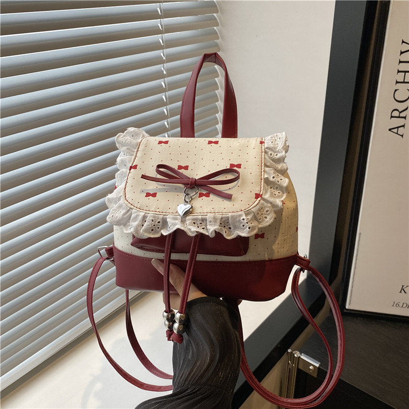 Bolsa de mano de moda coreana de chicas 2025 nuevo encaje de alto valor de la cara, mochila de hombro versátil