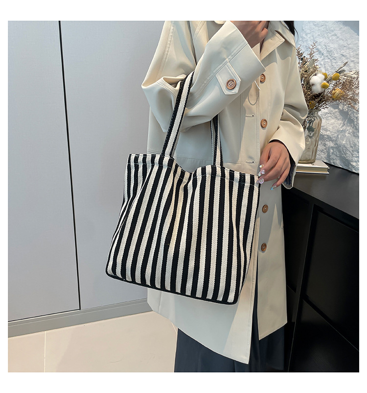 2024 Autumn/Winter new versatile and fashionable striped handbag shopping bag, two-tone large-capacity trendy single-shoulder bag undefined