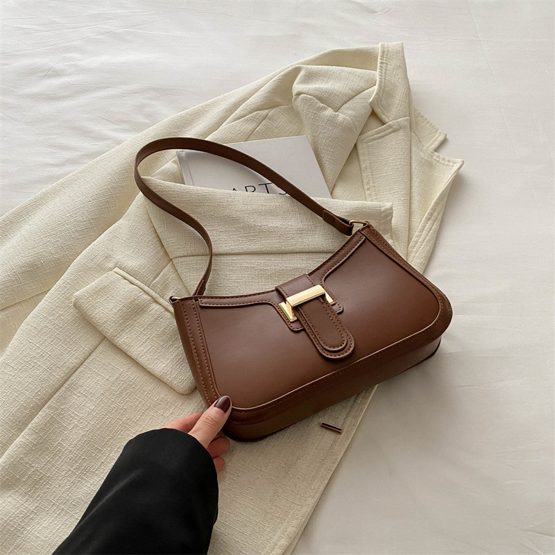 Bolsos de textura de alta calidad populares de nicho este año, bolsos de mujer retro simples, bolsos de hombro de viaje versátiles