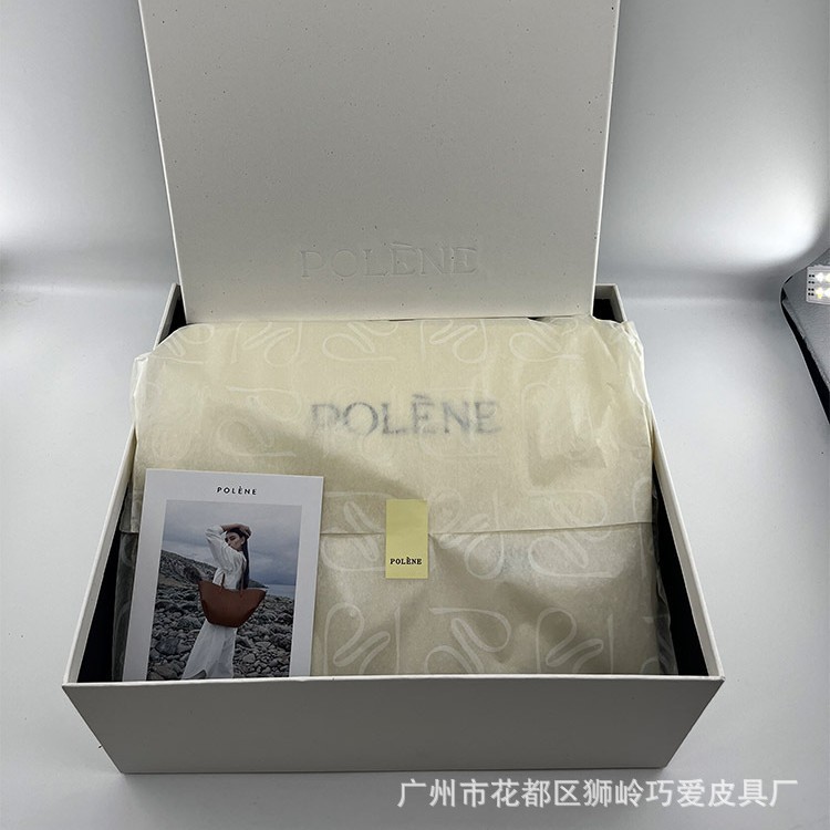 Nueva caja de regalo de nicho, bolsa de silla de montar, bolsa de compras, bolsa de bola de masa, bolsa de cara sonriente, bolsa de guisantes, bolsa de concubina real, papel de copia, juego completo