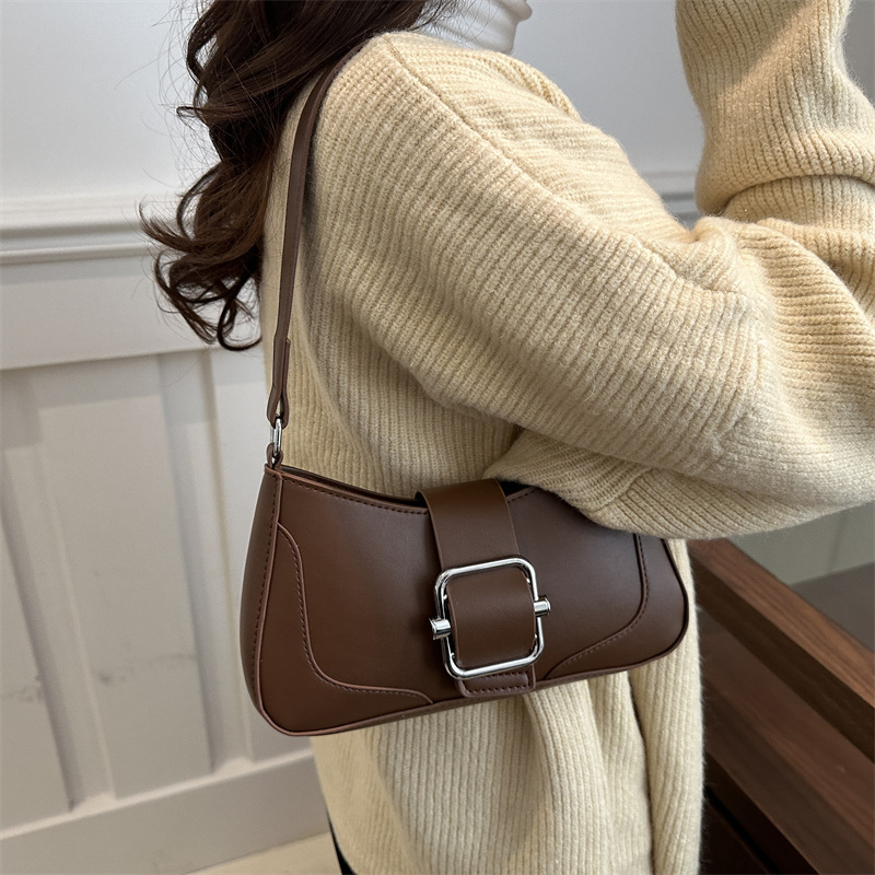 Versión coreana del bolso de axila de alta gama, popular de este año, bolso de palo francés de estilo occidental, diseño de nicho, bolso de hombro de temperamento de moda, viaje