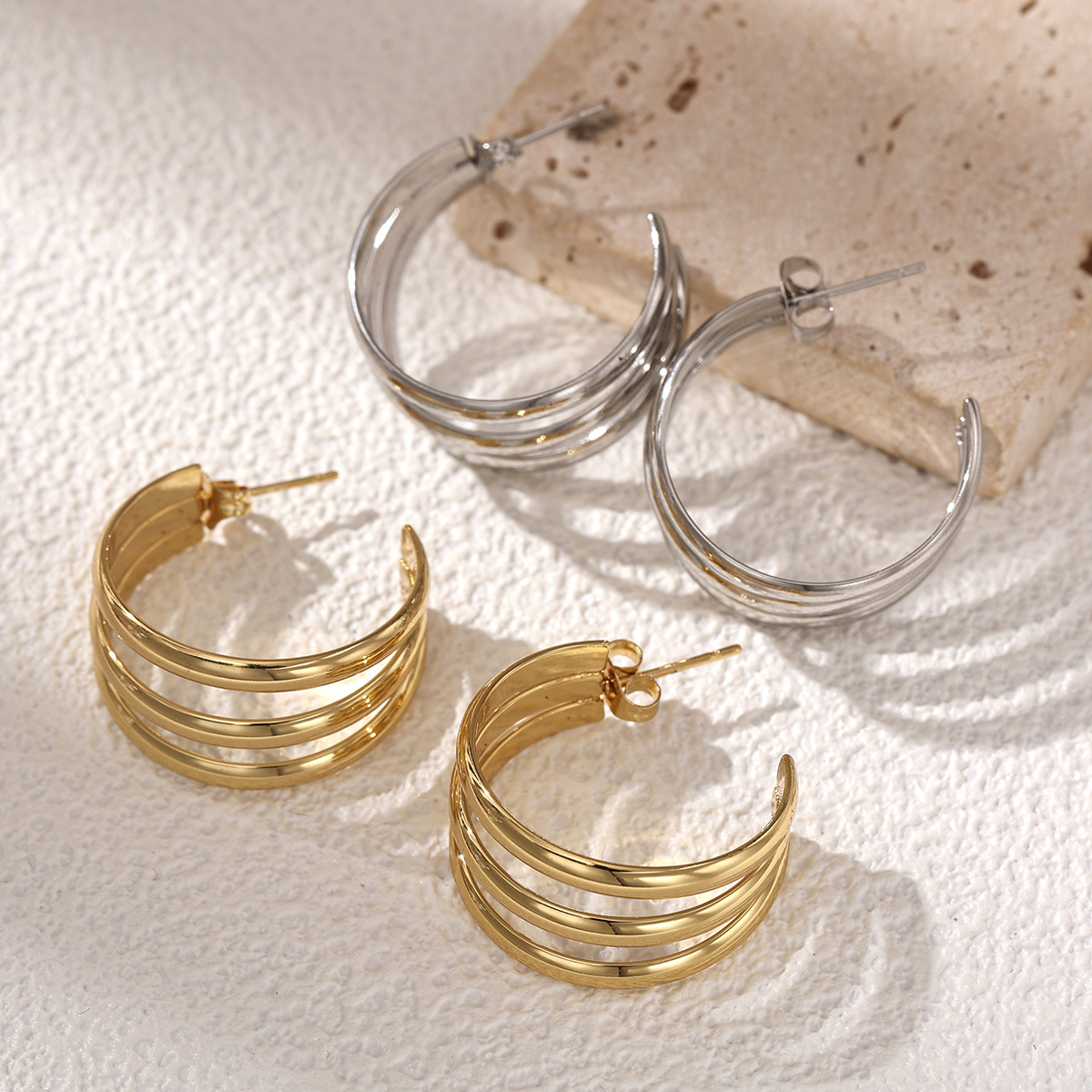 TENA europa y americana pendientes de acero inoxidable lujoso ligero de alta calidad sensación de acero dorado HOOP transfronterizo joyas de acero de titanio