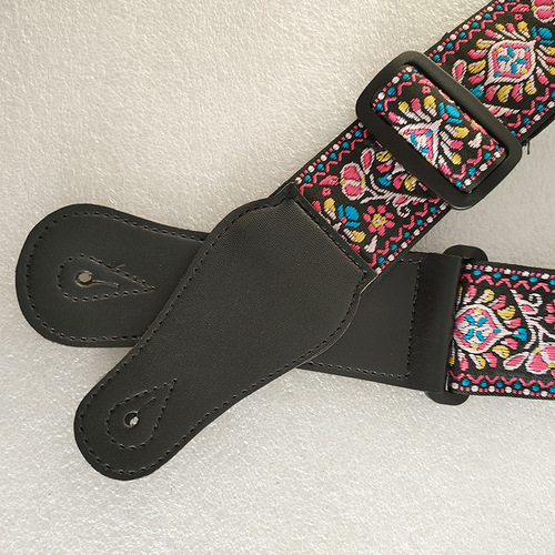 Factory-direct supply of musical instrument accessories—wholesale thickened and widened instrument straps, featuring ethnic-style woven ribbon with embroidered guitar straps.