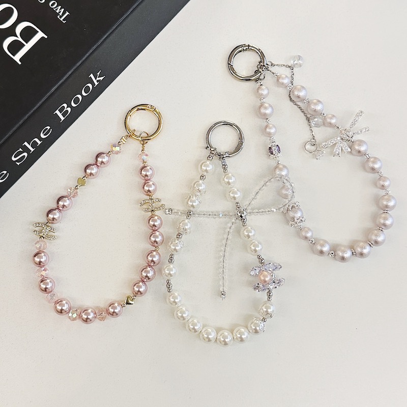 Boutique hecho a mano de alta gama cadena de teléfono móvil cadena de pulsera de perlas de tres colores cordón de teléfono móvil de moda colgante de mensajero largo