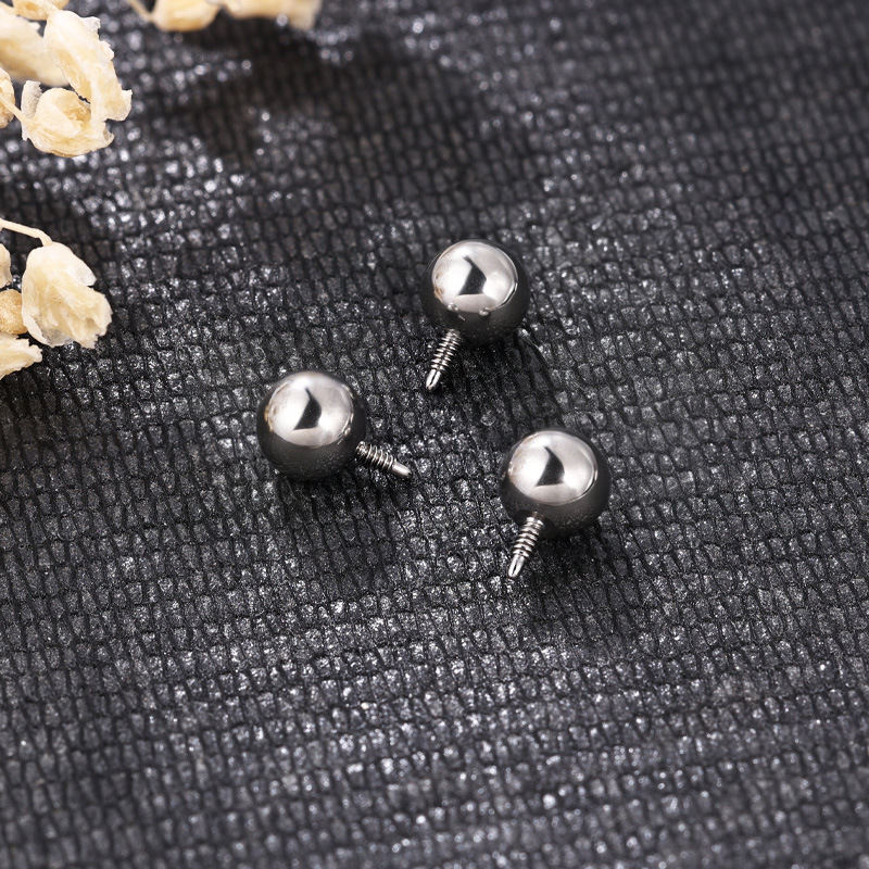 Silver pointed spike labret stud material detail