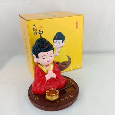 Solar car ornaments Buddha shook Car ornaments - solar-energy-nods-to-the-buddha-red-cassock
