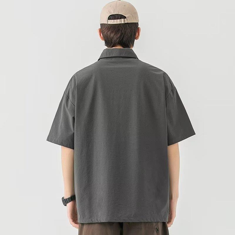 Moda juvenil popular simple nuevo color sólido estándar 2023 media manga verano versátil moda de los hombres polo