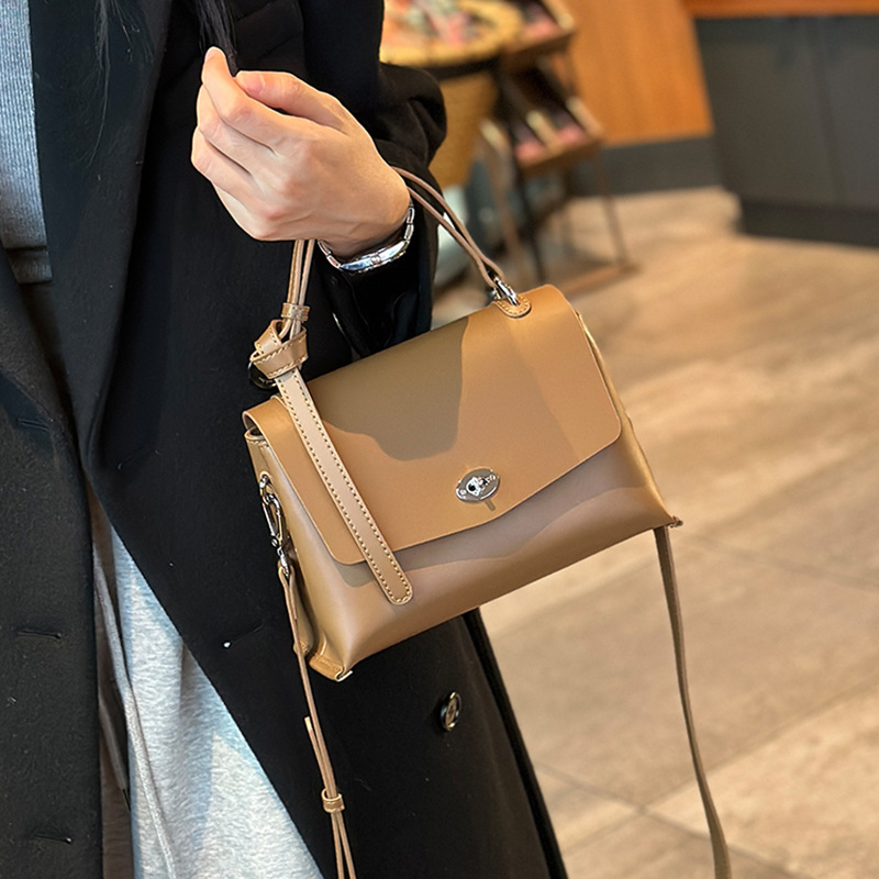 일괄 상단 레이어 Cowhide 잠금 핸드백 봄과 여름 새로운 하이 엔드 올 매치 숄더 백 통근 크로스 바디 백 여성용 가방