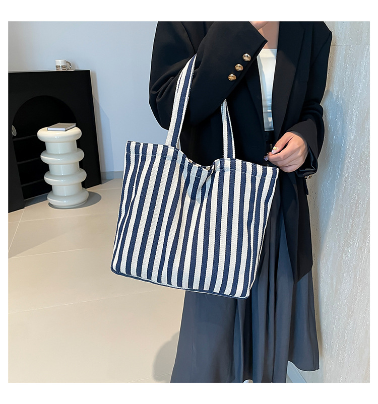 2024 Autumn/Winter new versatile and fashionable striped handbag shopping bag, two-tone large-capacity trendy single-shoulder bag undefined