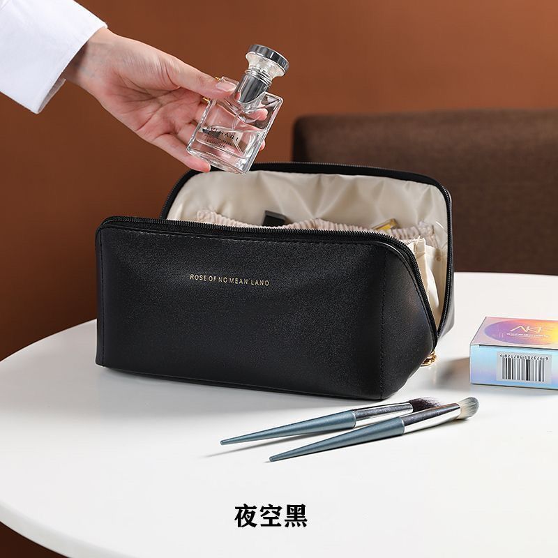 2023 Nueva celebridad de Internet PU bolsa de cosméticos de doble cremallera bolsa de lavado Portátil Bolsa de almacenamiento de cosméticos de viaje textura