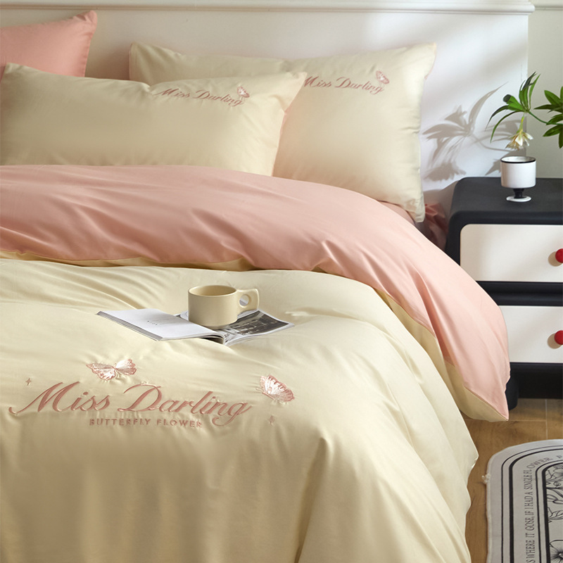 Estilo de lujo ligero 40 piezas de algodón puro traje de cuatro piezas corazón de niña bordado floral funda de edredón ropa de cama de algodón suave de alta calidad