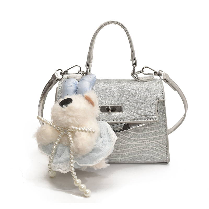 Bolso Kelly portátil de alta gama de moda transfronteriza para mujer 2025 nuevo estilo salvaje estilo occidental color sólido bolso de mensajero casual de un solo hombro