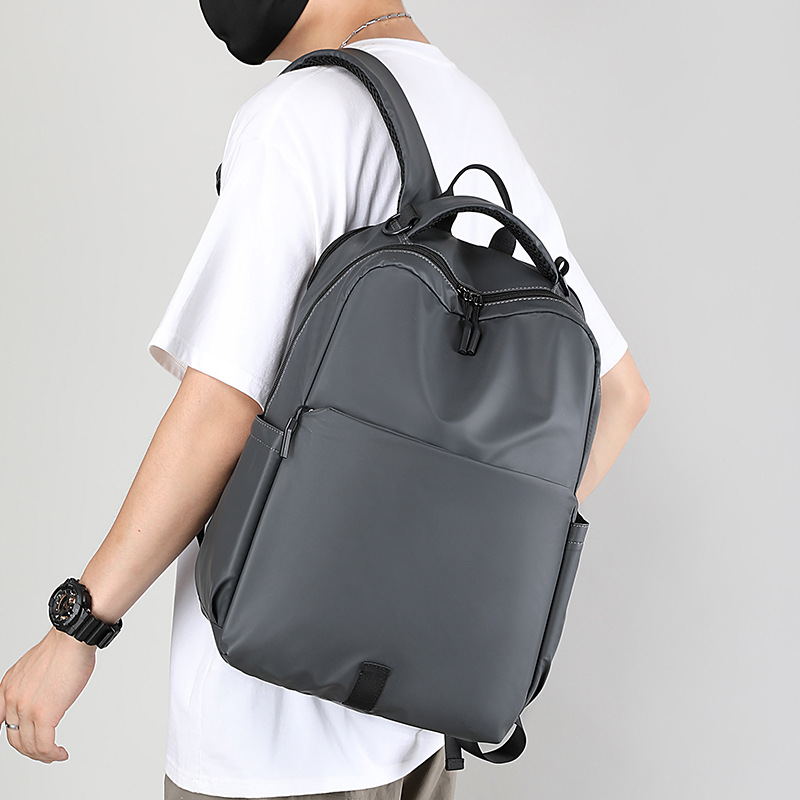 Nueva mochila de hombro ocio de negocios simple, bolsas de computadora de viaje de estudiantes de secundaria, mochila de viaje urbano para hombres