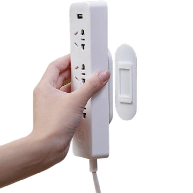 Row plug holder etiqueta de la pared colgante de almacenamiento sin fisuras fila Punch-free plug Board socket colgante de pared adhesivo