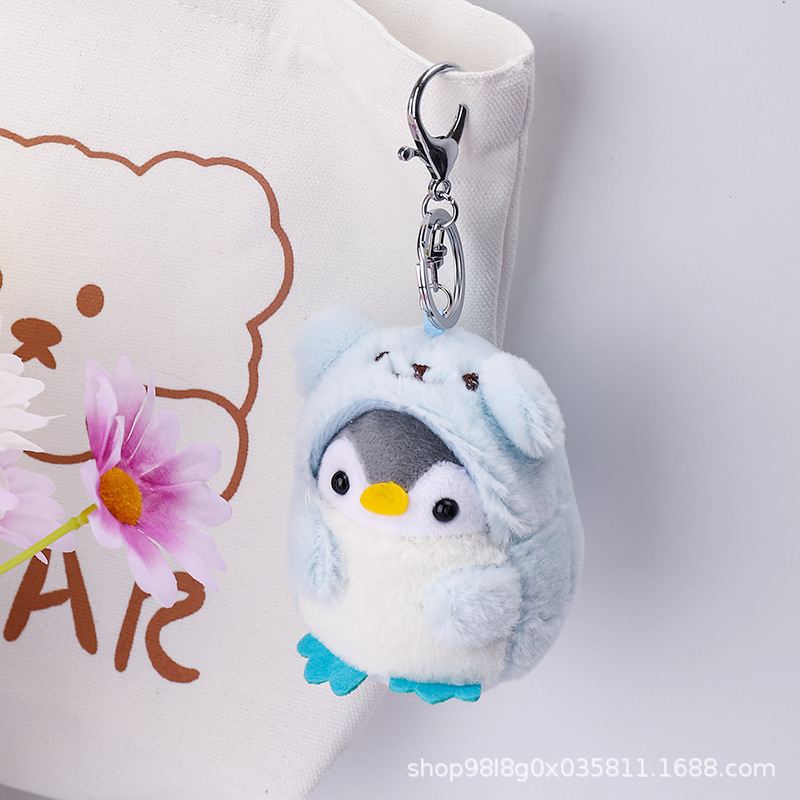 かわいいアニメ旅行ペンギンのリュックサックは子供のキーホルダーのぬいぐるみのプレゼントを掛けます。|undefined