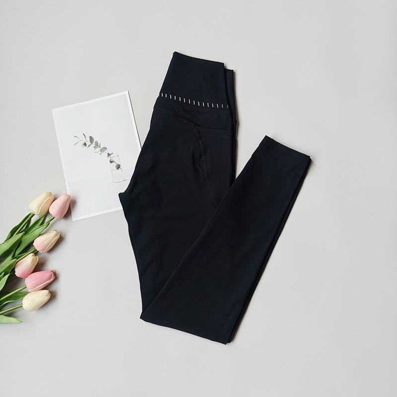 Pantalones de fitness desnudos para mujeres sonrientes líneas de elevación de cadera pantalones deportivos para mujeres al aire libre cintura alta sin marcas nueve puntos pantalones de calzado