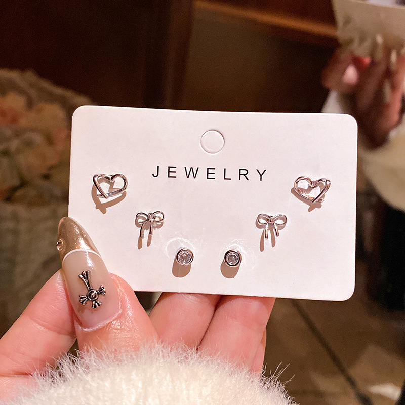 S925 aguja de plata exquisito ZIRCON oído-aumento traje pequeño oído espárragos Luz de lujo nicho versátil temperamento perla pendientes femeninos