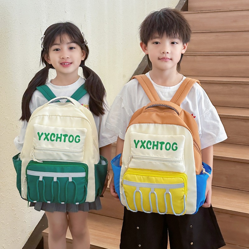Mochila escolar coreana para niños y estudiantes con letras de color contrastante personales para reducir la carga de la mochila de jardín de infantes de gran capacidad