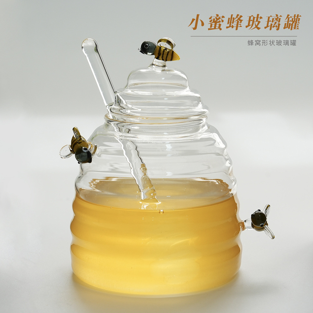 Botella de miel de vidrio de alto silicio al por mayor botella de miel de embalaje de miel transparente varilla de agitación creativa jarra de vidrio de abeja