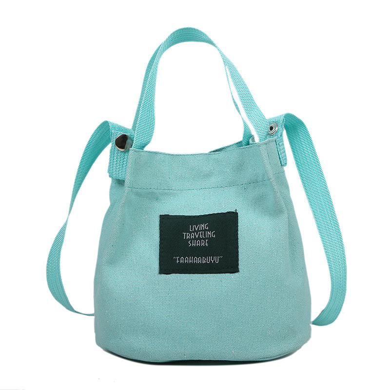 Bolso de mujer nuevo estilo coreano simple bolso de lienzo de chicas fresco de color sólido bolso de cubo de moda moda bolsa de mochila casual