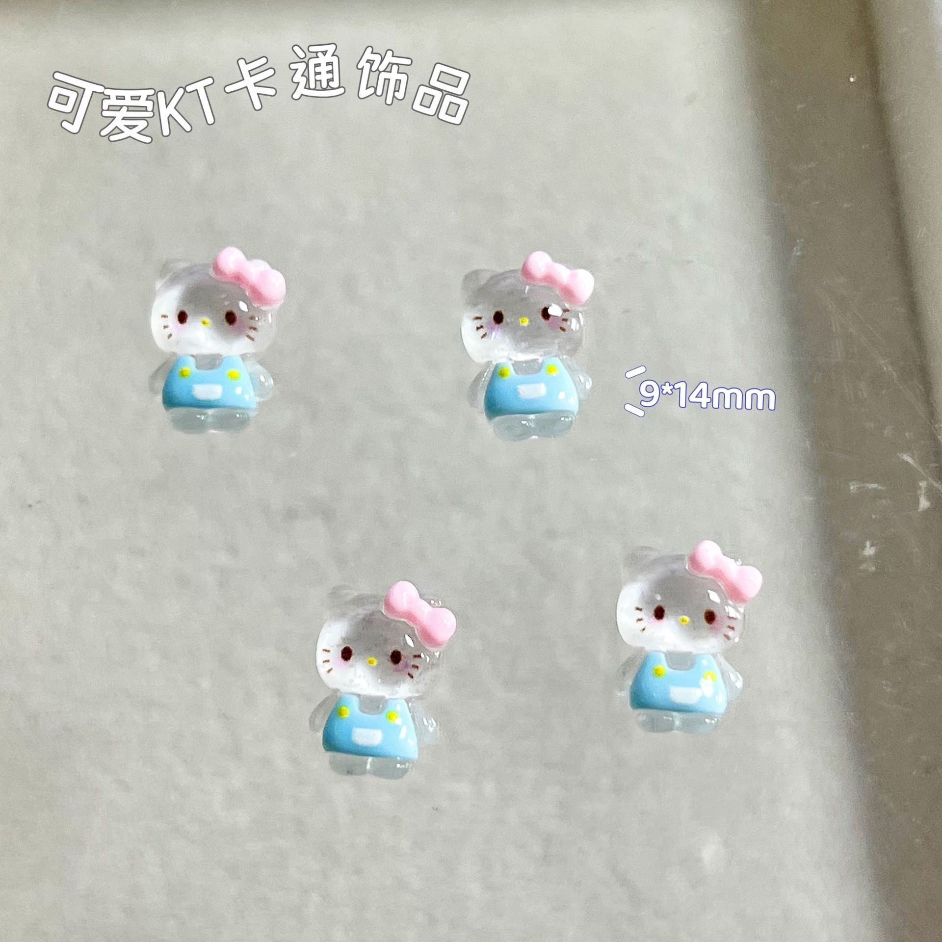 新商品のキティキャットの三麗鴎のネイルアクセサリーのネットの赤い爆発の樹脂のかわいいkt猫は甲を着て飾ります。