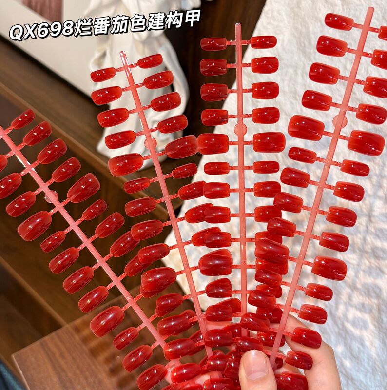 Glossy, tomato-red nail tips, 36 pieces, multi-shaped, for easy application, creating a festive New Year nail art look