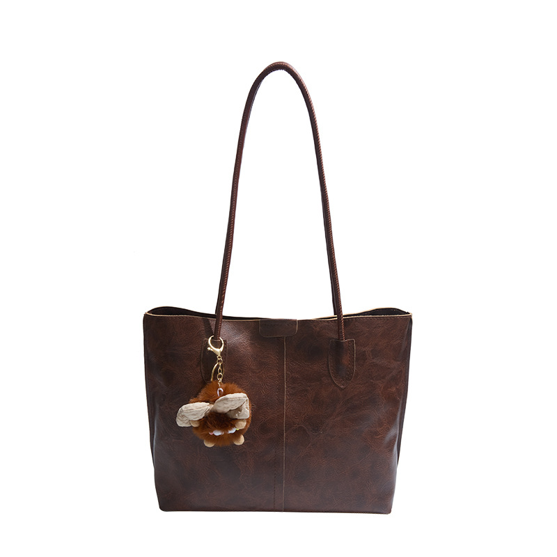 Moda de gran capacidad de la cara suave 2025 primavera nuevo colgante de ocio retro color sólido simple bolso de hombro axilar de mano