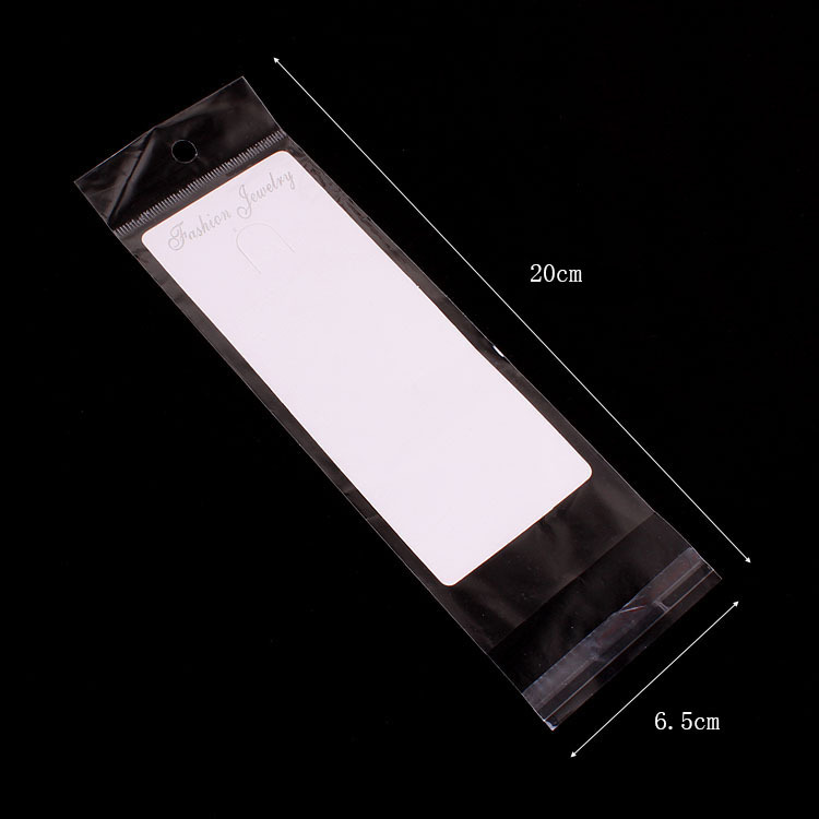 厂家直销  包装饰品透明opp袋子6.5*20cm 带挂头带胶内空6.5*15cm