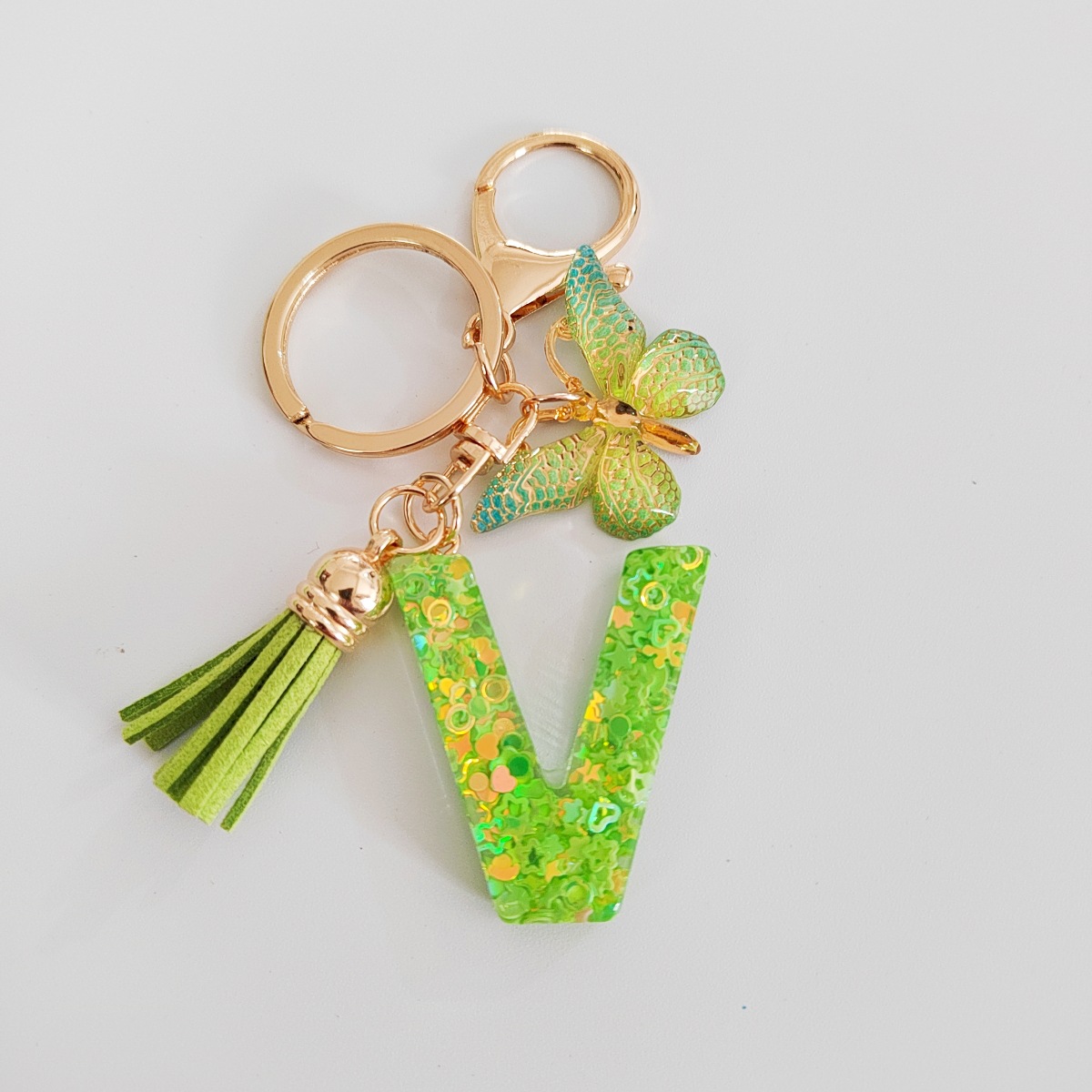 26 letras inglesas llavero colgante estrella verde brillo gota resina colgante llavero de personalidad europea y americana