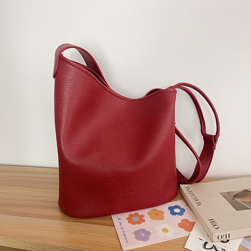 Bolso de cubo de textura transfronteriza 2025 verano nuevo bolso femenino estilo ins bolso de hombro simple