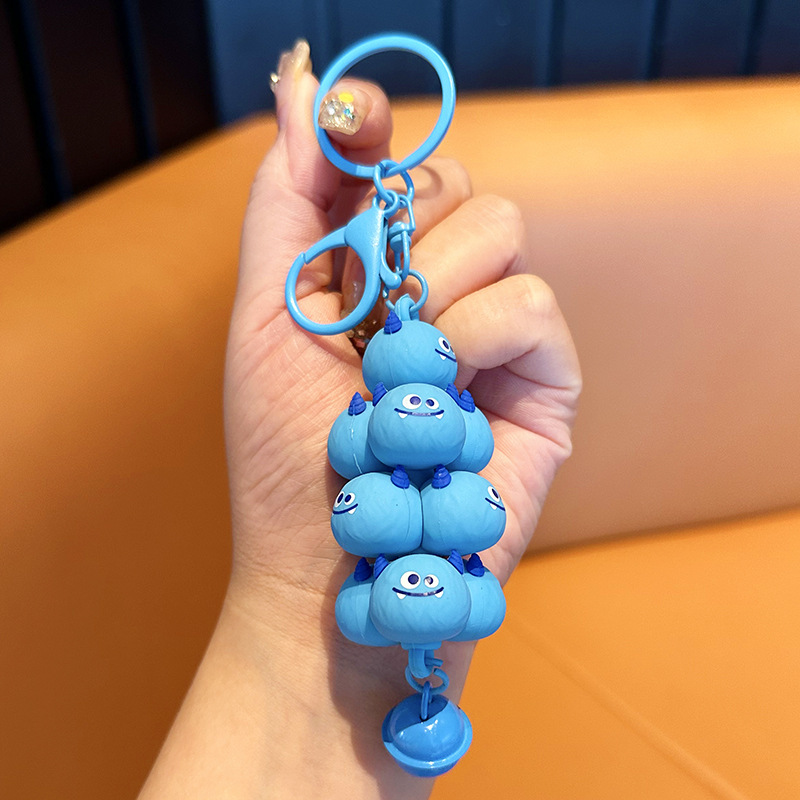 Popular en línea rojo creativo monstruo de dibujos animados jengle lindo mochila colgante coche llavero pareja pequeño regalo