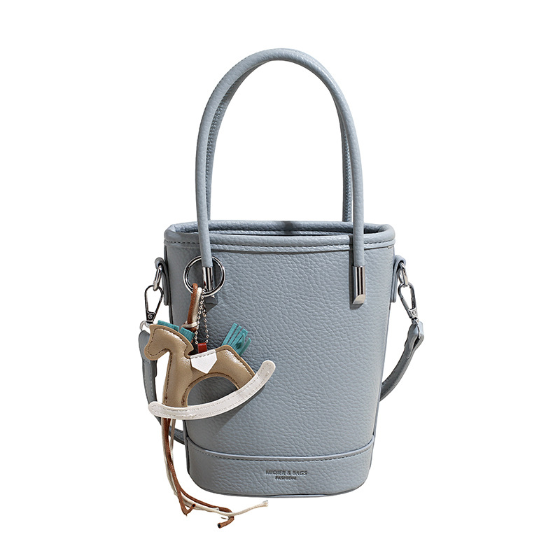 2026 nueva moda versátil bolso de mochila, sensación diaria de lichi, bolso de cubo de agua