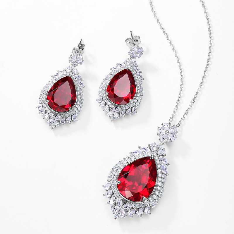 2023 nuevos pendientes de plata S925 pendientes de corindón rojo y azul lujo noble temperamento estilo europeo y americano en el pelo de la generación de stock