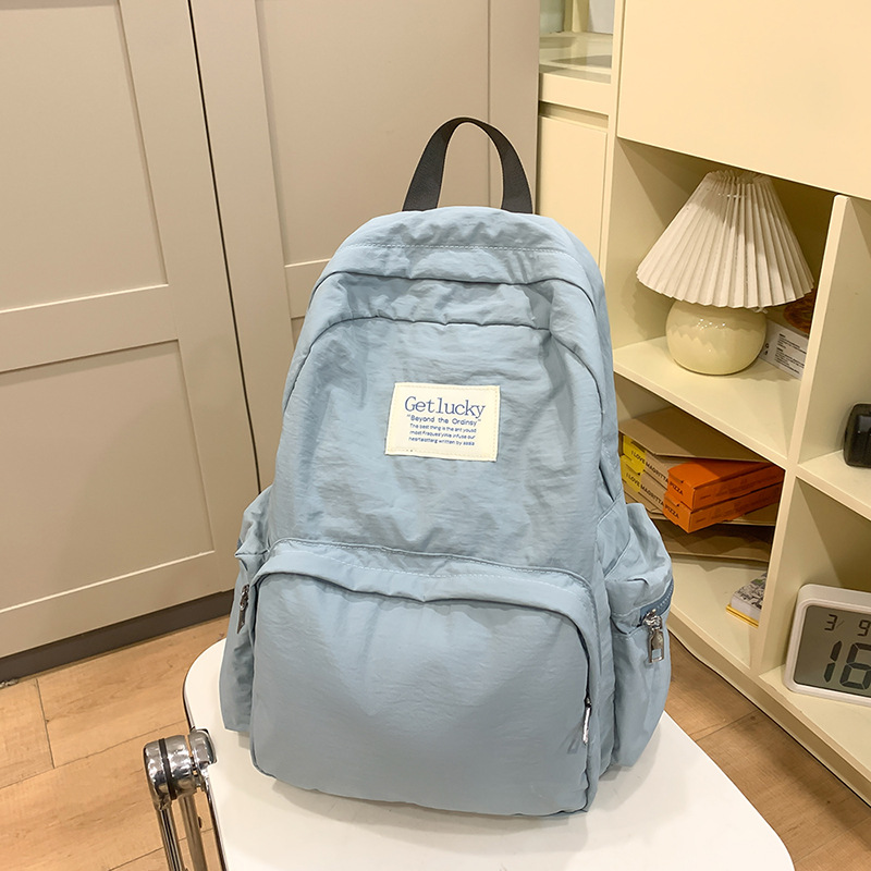 2025 nueva mochila para estudiantes universitarios japoneses, mochila escolar ligera, mochila de viaje simple, impermeable y de gran capacidad