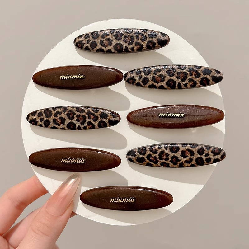 Corea del Sur Dongdamen nuevo temperamento simple estricto leopardo serie de clip de pelo universal clip de frangeo clip de pelo roto adornamiento de cabeza mujer
