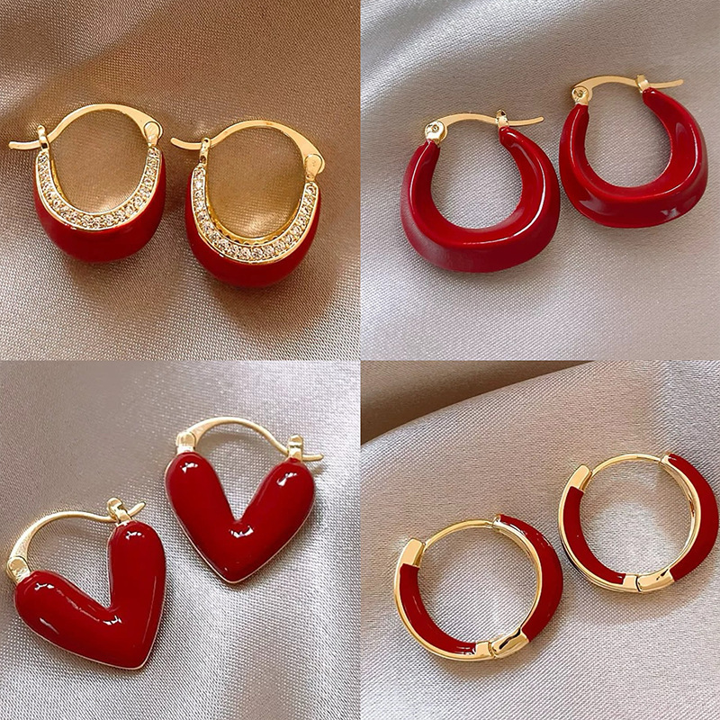 Pendientes de amor con goteo de aceite rojo con aguja de plata, botones de oreja de temperamento de moda de nicho, pendientes simples y de alta gama de estilo de Hong Kong