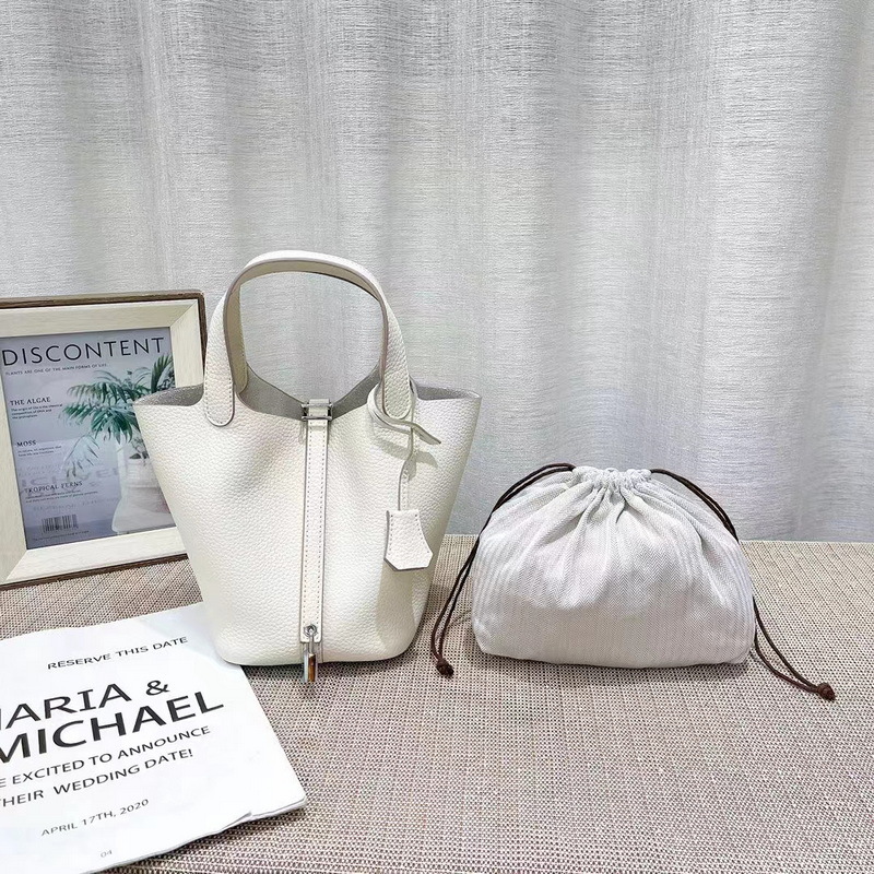 El nuevo bolso de cesta de verduras de marea de cuero togo de piel de vaca de capa superior 2025, bolso de cubo con cerradura de mano, bolso de cuero para mujer