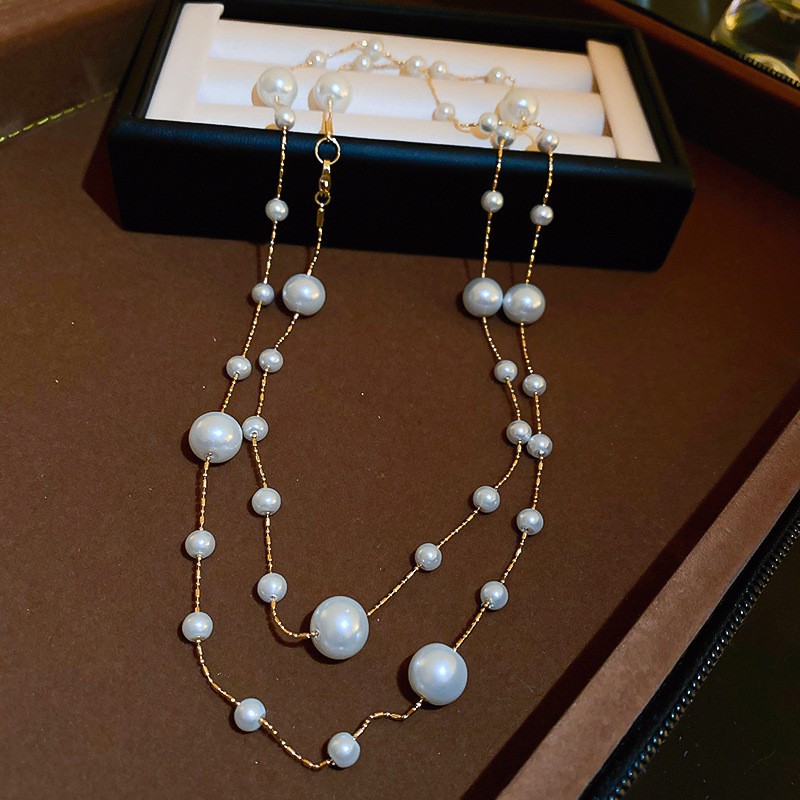 Collar con cuentas de perlas de gota de agua con diamantes transfronterizos otoño e invierno cadena de suéter de lujo ligero francés moda todo fósforo joyería de alta gama