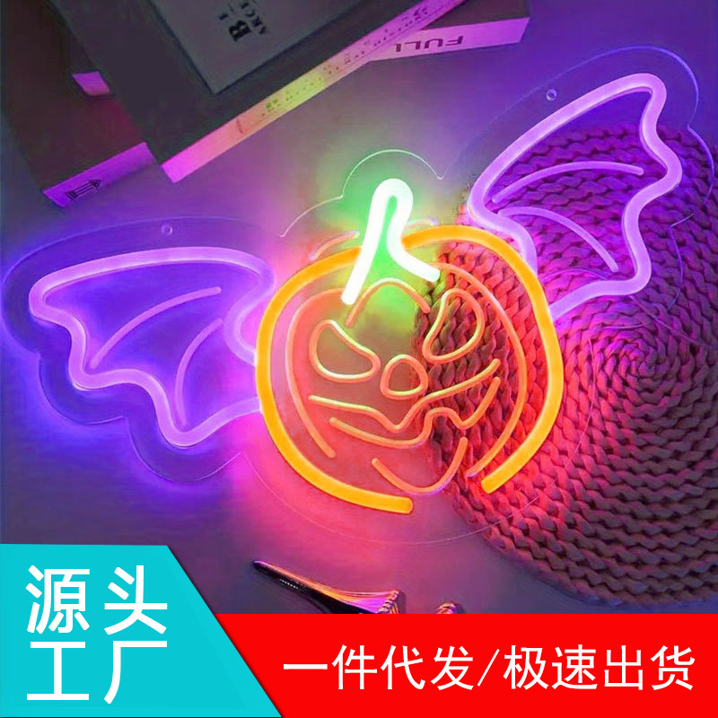 USB-powered LED neon illuminated lettering - glowing pumpkin and bat design, perfect for Halloween.