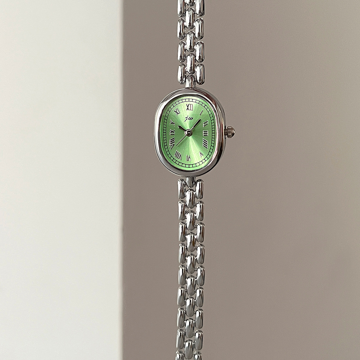 Silver shell green surface