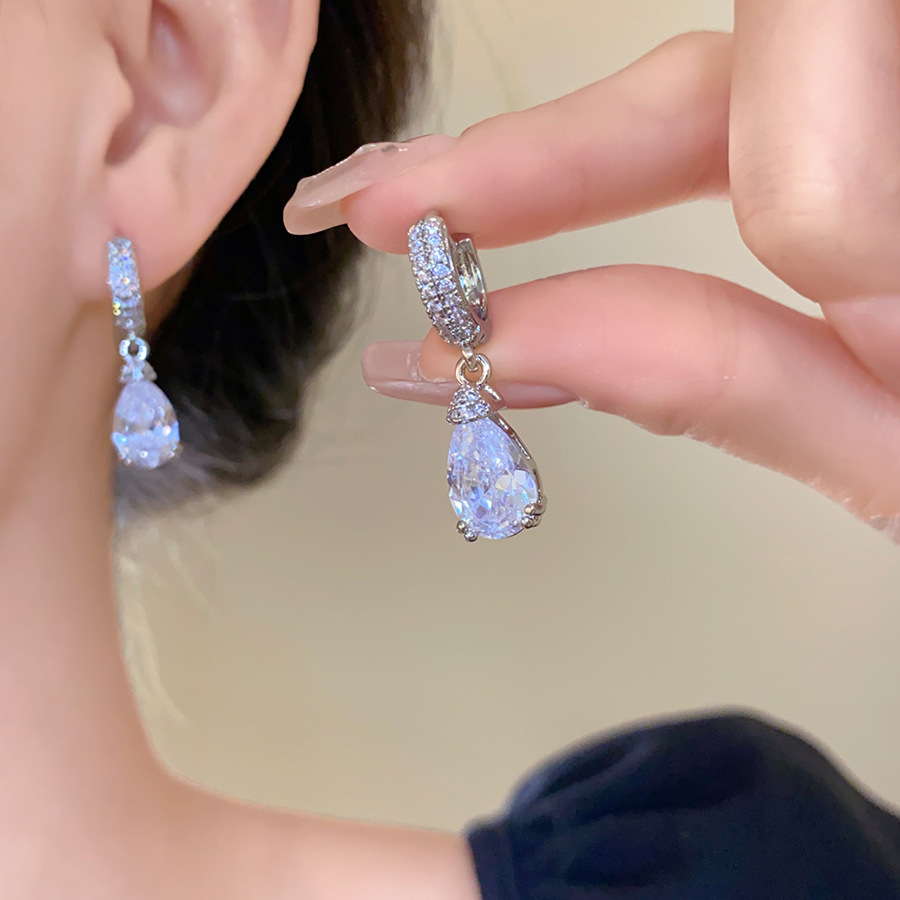 Pendientes de flor de lazo elegante de súper hada de plata Pendientes de moda de lujo ligero francés Pendientes de todo fósforo dulce de estilo literario